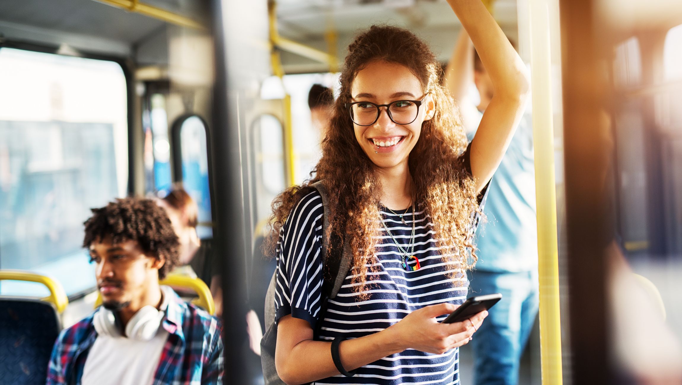 a woman and man riding a bus